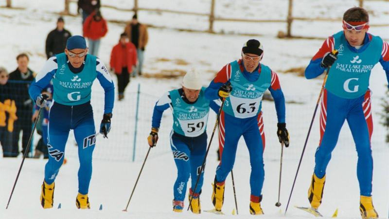 Elite Paralympic These skiers make their way up the hill during the Men's B2 Short Distance at Soldier Hollow