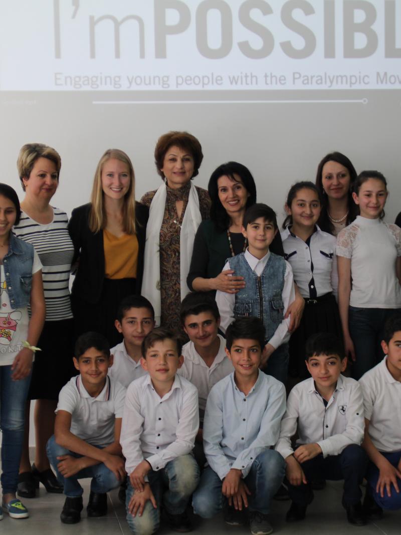 a group of schoolchildren pose for a photo 