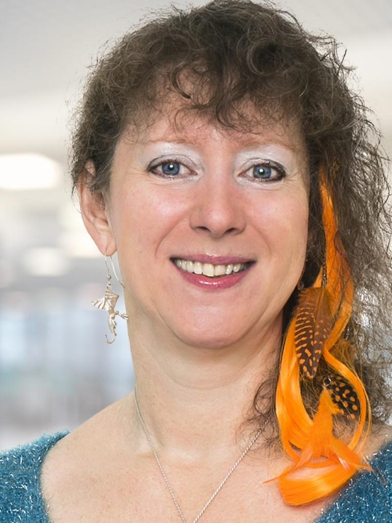 a woman smiles for the camera