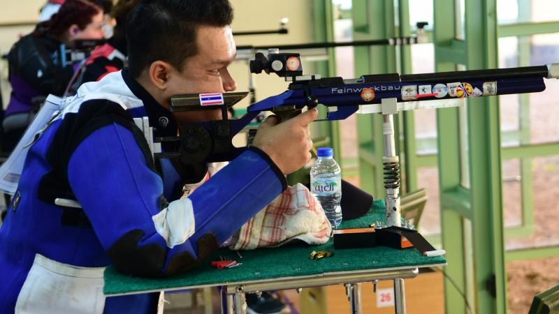 R9 (mixed 50m rifle prone SH2) - shooting Man competing in R9 (mixed 50m rifle prone SH2) event