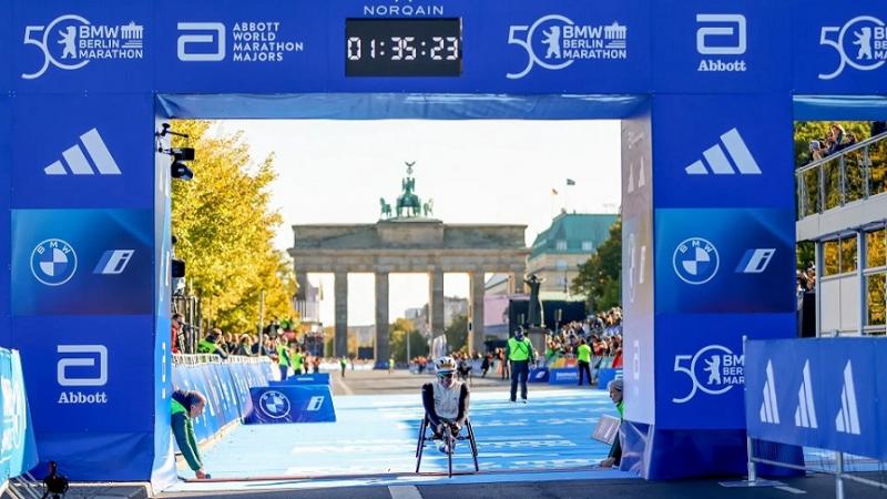A wheelchair racer crossing the finish line of the Berlin Marathon