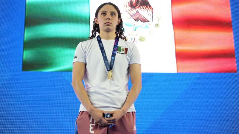 A player poses on podium