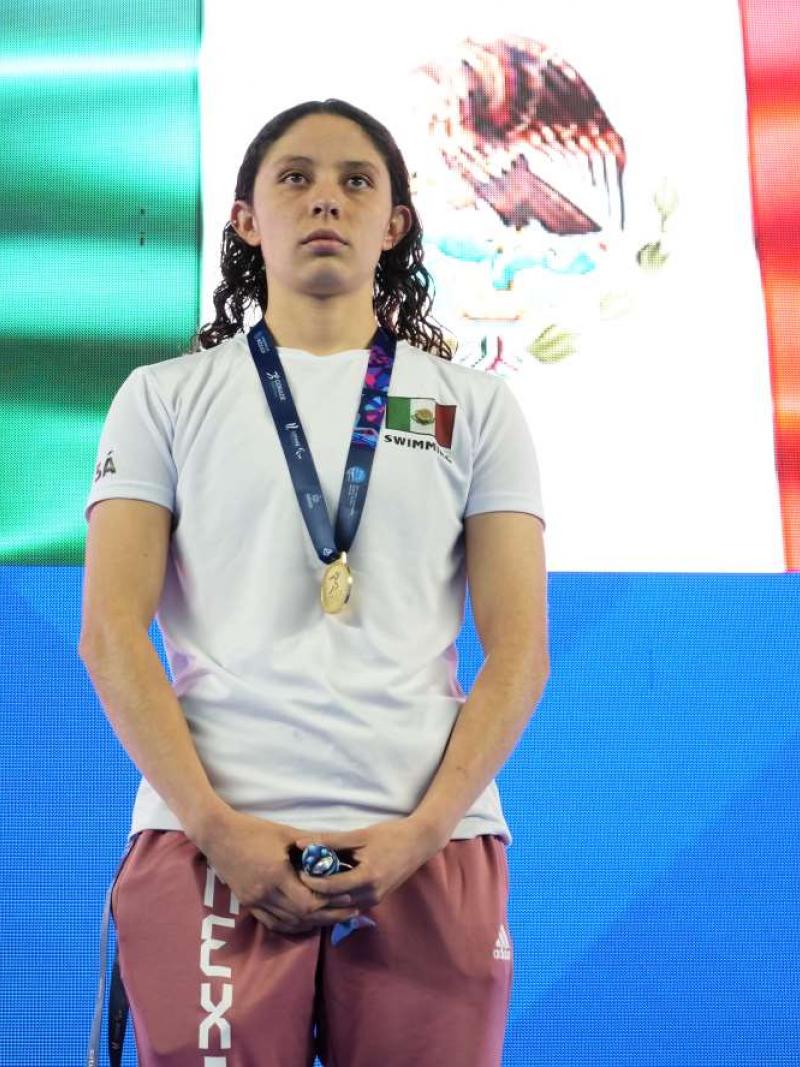 A player poses on podium