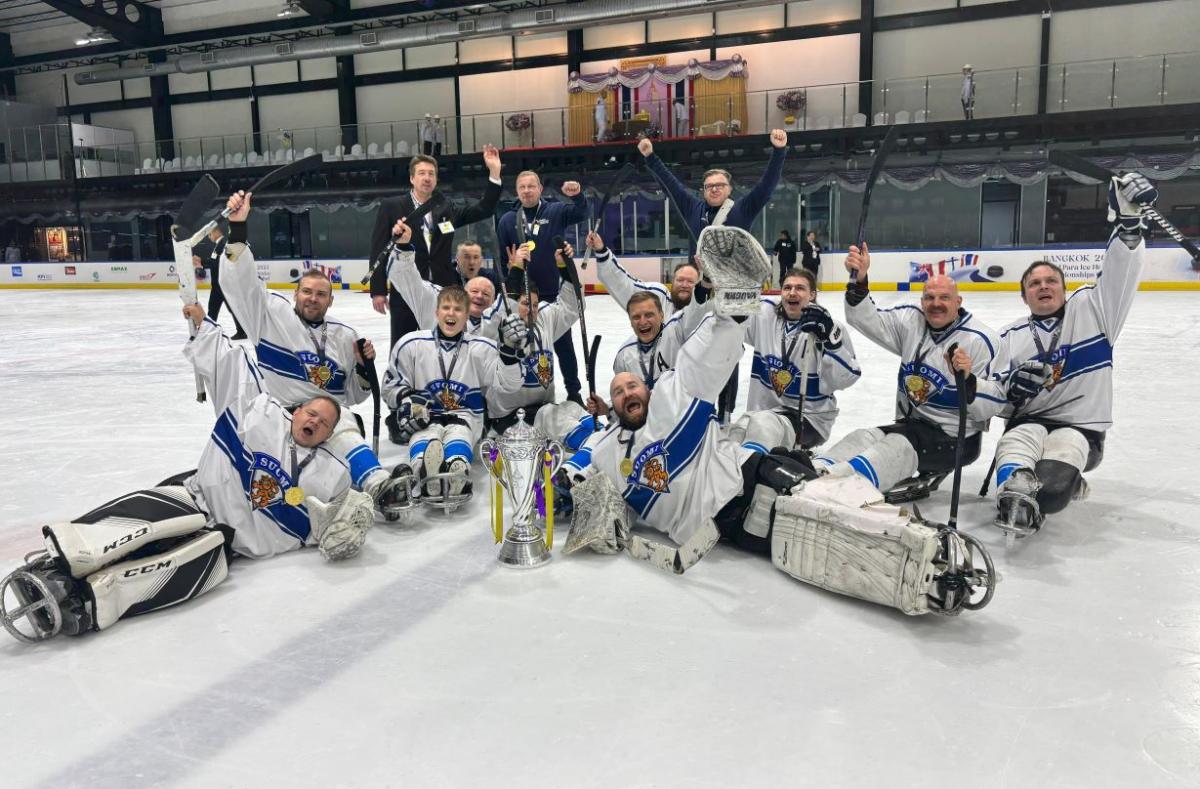 Finland Para ice hockey national team celebrating on an ice rink