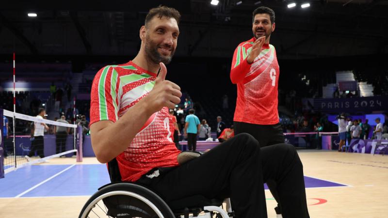 Morteza Mehrzadselakjani smiles and gives a thumbs up to the camera