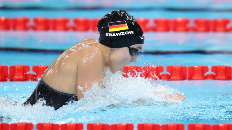 A female swimmer in a breaststroke race