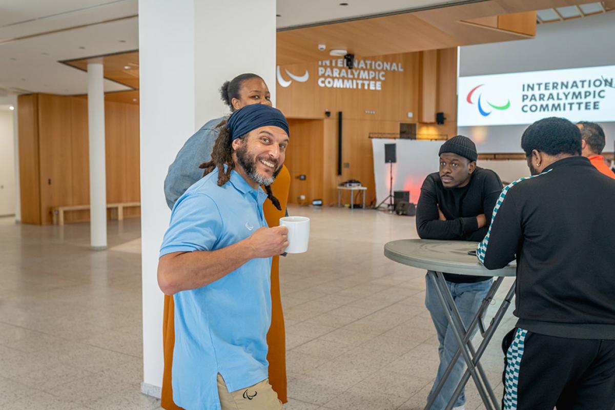 Five IPC staff members socialise in the new headquarters