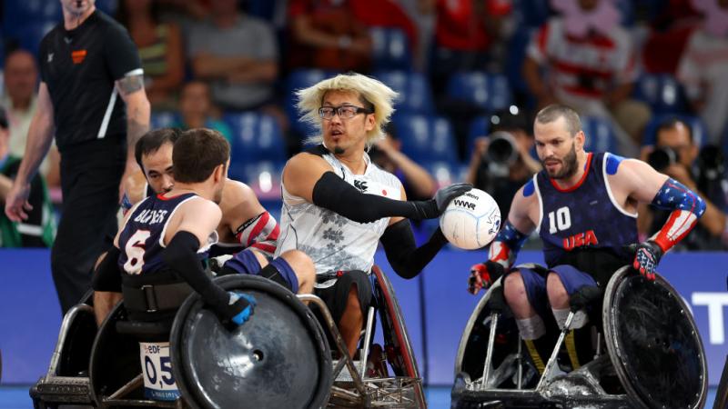 Japan's Daisuke Ikezaki carries the ball