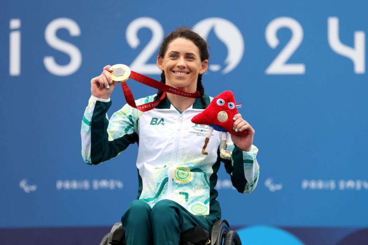 Lauren Parker poses for a photo after receiving a gold medal