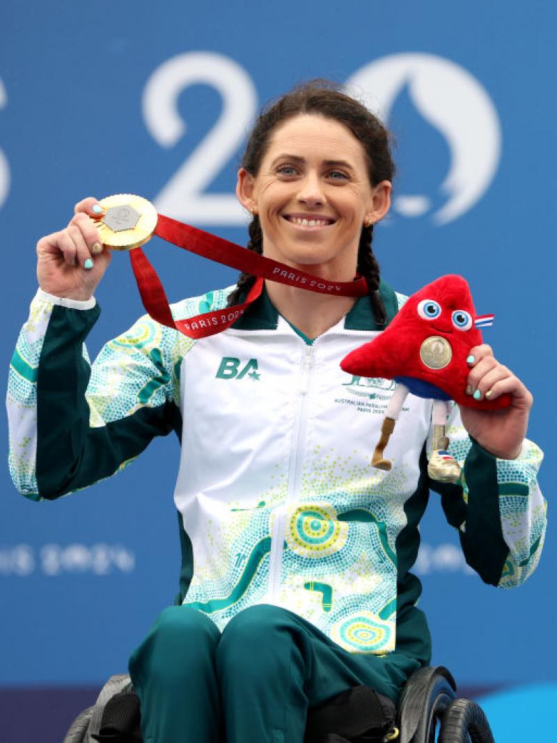 Lauren Parker poses for a photo after receiving a gold medal