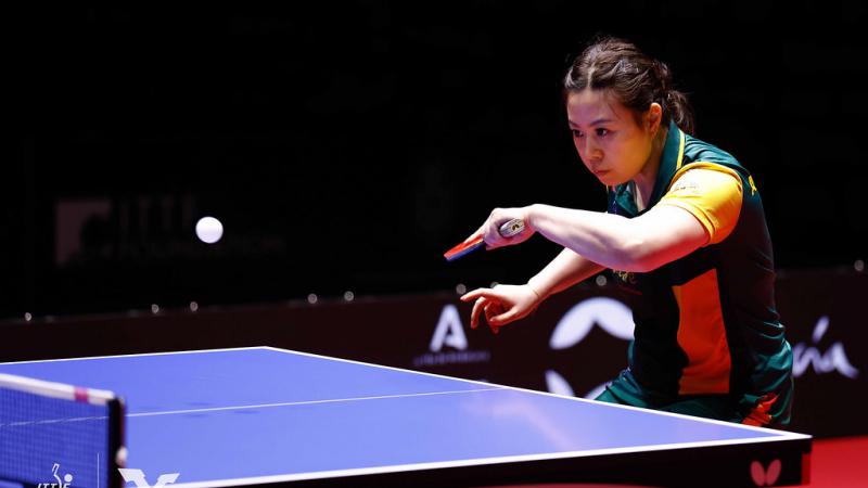 A female Para table tennis player in action.