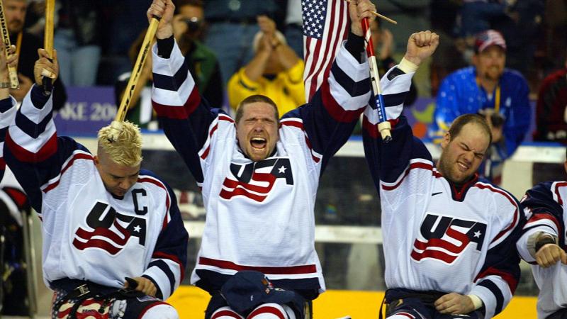 Three USA Para ice hockey players celebrating