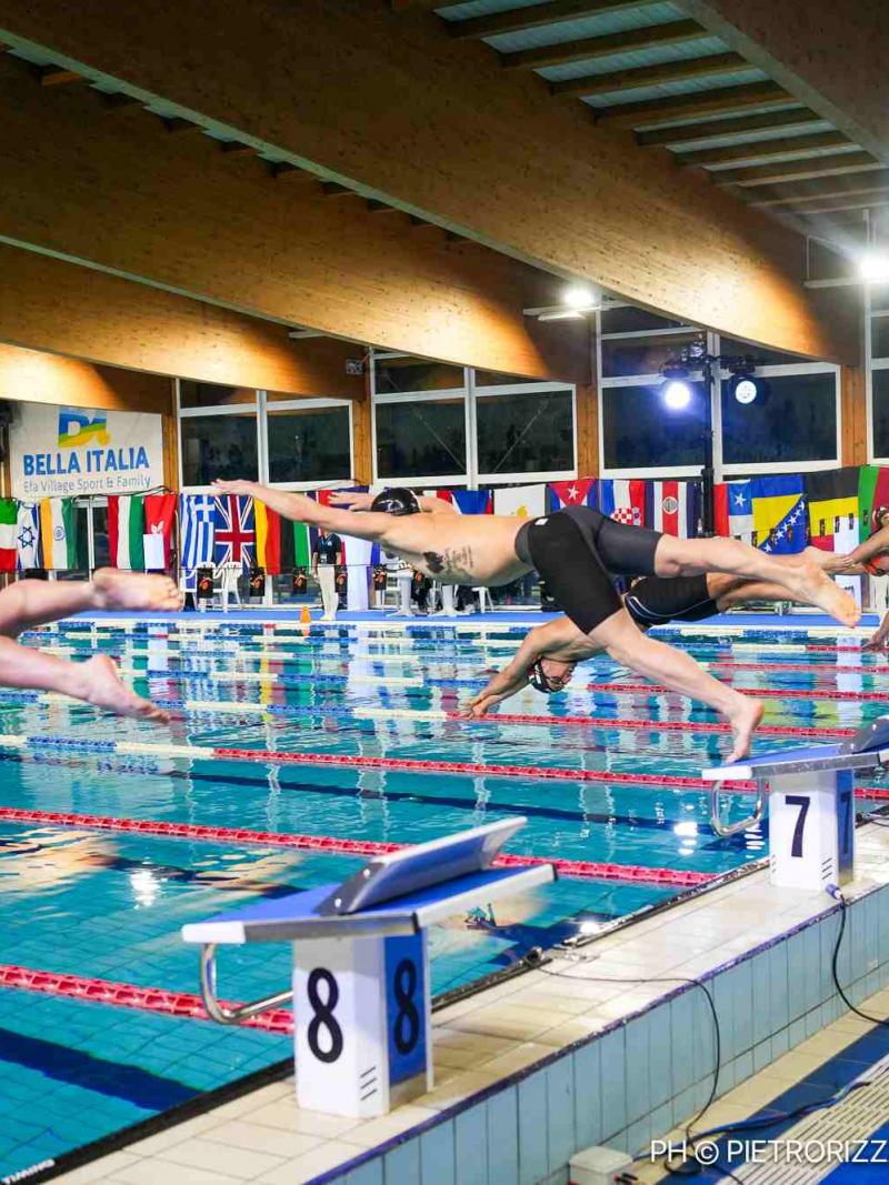 Swimmers jump into the pool to start their campaigns